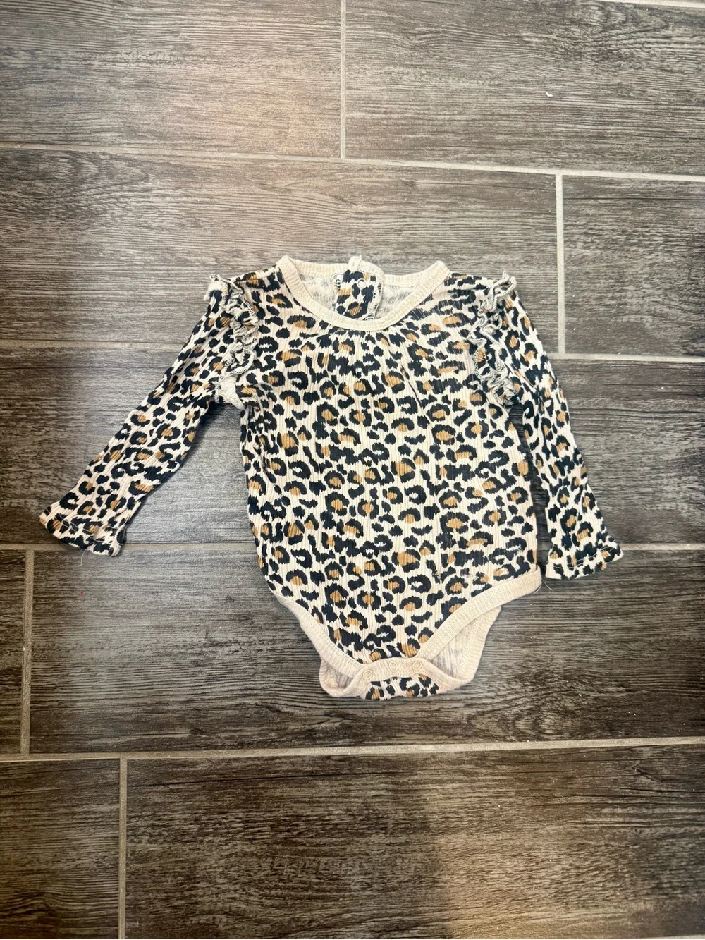 Size 3-6 month leopard onsie…